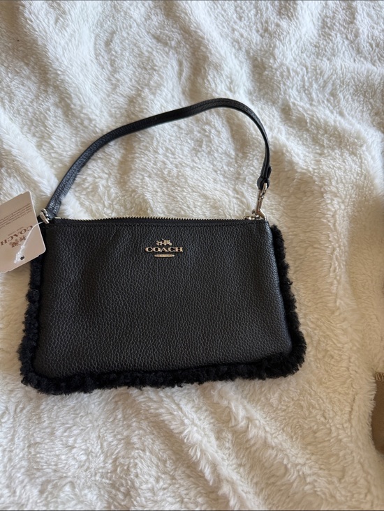 Coach Handbags - Coach Black Leather Wristlet with Shearling Trim